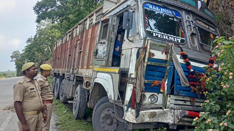 A woman along with 2 youths riding a bike was crushed by a truck