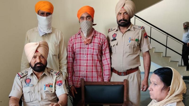 Balraj Singh Fauji and his father Gursevak Singh in police custody Balraj Singh Fauji and his father Gursevak Singh in police custody