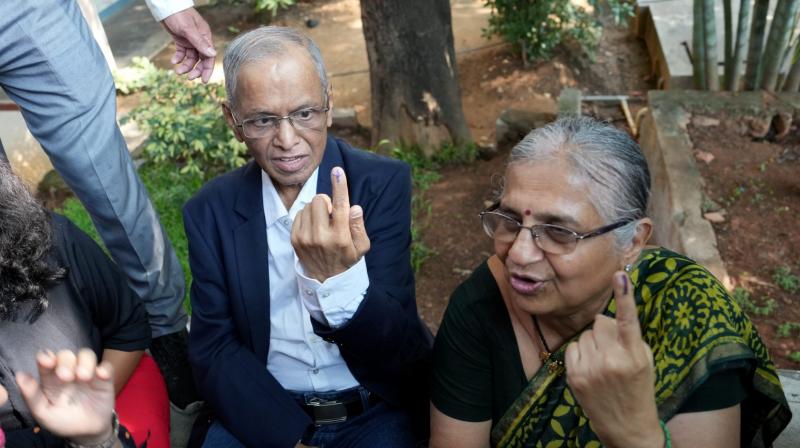 Infosys founder NR Narayana Murthy and wife Sudha Murthy after casting their vote Infosys founder NR Narayana Murthy and wife Sudha Murthy after casting their vote