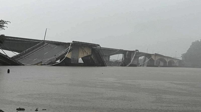 The bridge built on Kali river in Uttara Kannada collapsed The bridge built on Kali river in Uttara Kannada collapsed