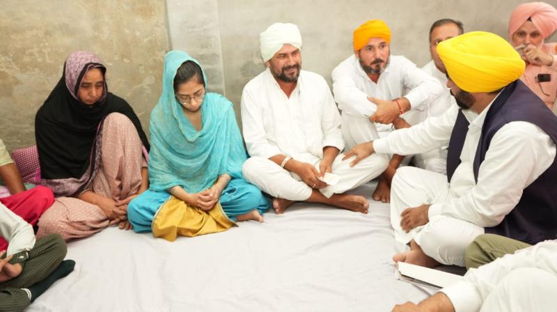 CM Bhagwant Mann hands over a check of Rs 1 crore to family of Agniveer Shaheed Amritpal Singh