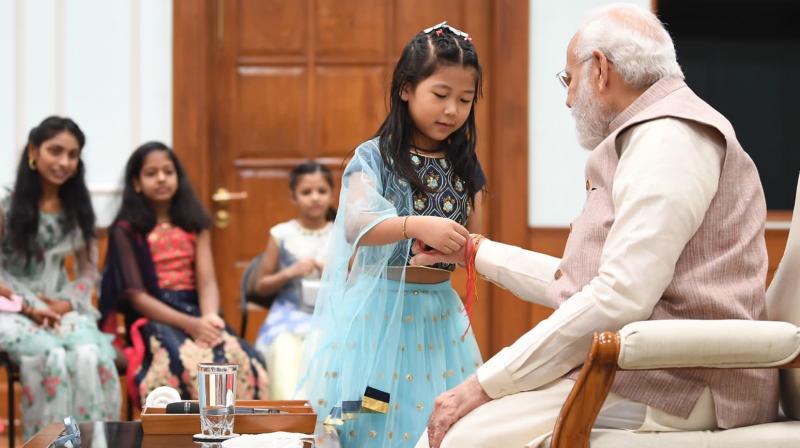 PMO staff's daughters celebrate Raksha Bandhan with PM Modi PMO staff's daughters celebrate Raksha Bandhan with PM Modi