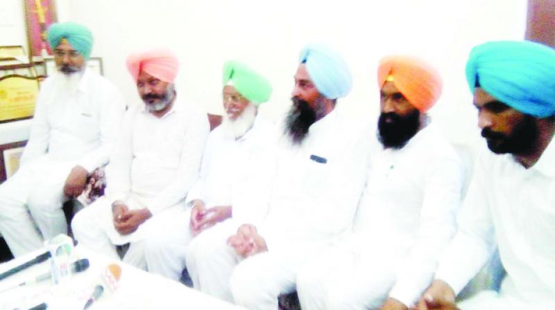 During the press conference, Harpal Singh Cheema and others During the press conference, Harpal Singh Cheema and others