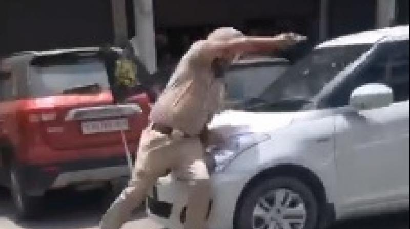 Stopped for checking, car driver drags cop to a distance in Patiala 