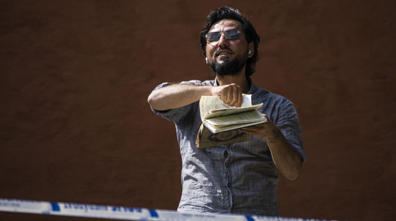 Man tears up, burns Quran outside mosque on Eid holiday in Sweden