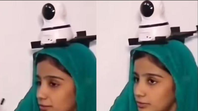 Pakistani Woman installing CCTV on head Pakistani Woman installing CCTV on head