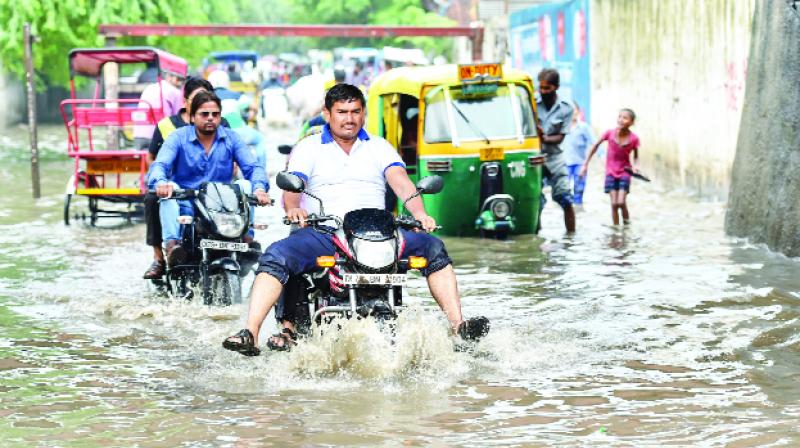 Pepoles passed through the standing water due to the Rain