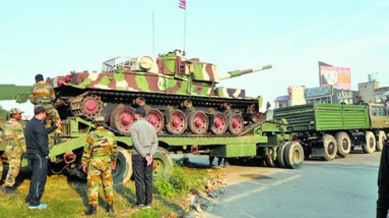 Army men removing tank from PAP Chowk Army men removing tank from PAP Chowk