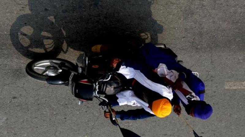 Sikhs have to wear helmets