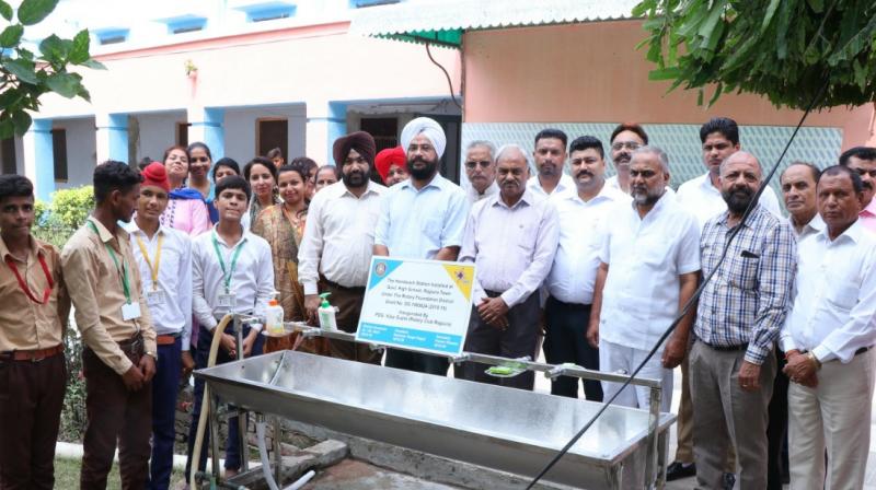 Rotary club installed hand wash portable station in high school