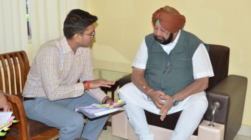 Captain Amarinder Singh and Vipul Ujjwal Captain Amarinder Singh and Vipul Ujjwal