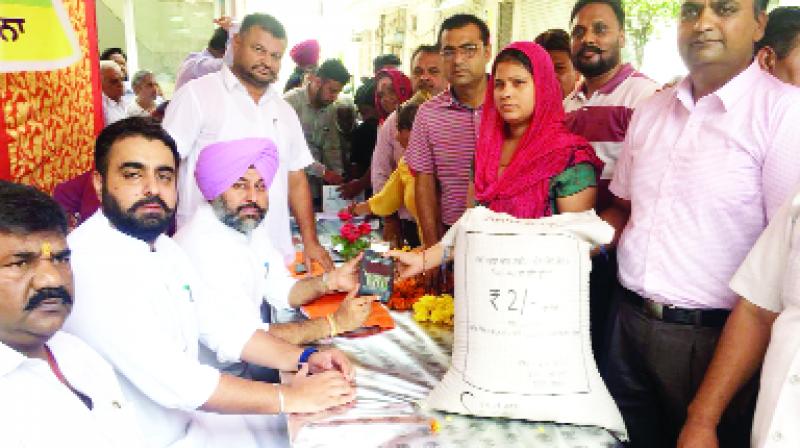 Gurkirat Singh Kotli inaugurating distribution of ration through EPOS machine