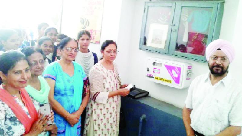 Social worker Shashi Datta with sanitary machine given to school.