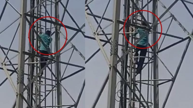 Young man climbs tower for release of bandi singh and justice for guru granth sahib disrespect Young man climbs tower for release of bandi singh and justice for guru granth sahib disrespect