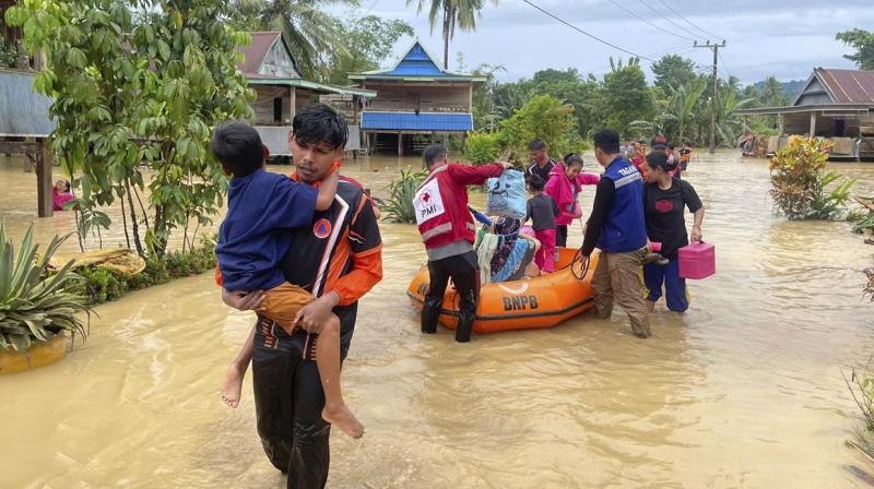 Flood and landslide hit Indonesia's Sulawesi island, killing 14 Flood and landslide hit Indonesia's Sulawesi island, killing 14