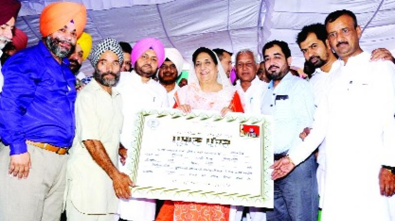 Bibi Bhathal Giving Loan relief Certificates Bibi Bhathal Giving Loan relief Certificates