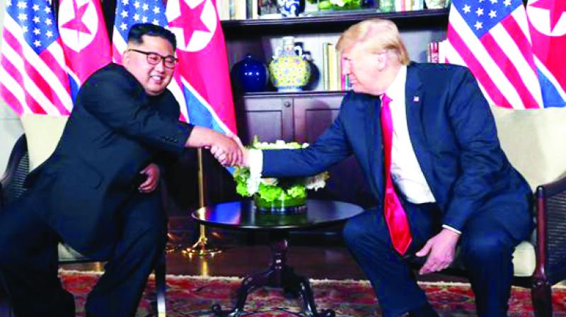 Kim Jong-Un shaking hands with Donald trump Kim Jong-Un shaking hands with Donald trump