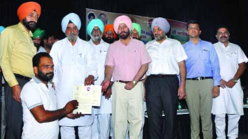 Farmers getting certificates Farmers getting certificates