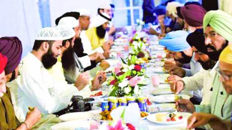 Muslims taking Food with Sikhs