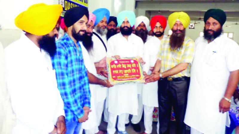 Giving Honor to Simarjit Singh Bains by Dashmesh Pita Welfare Society