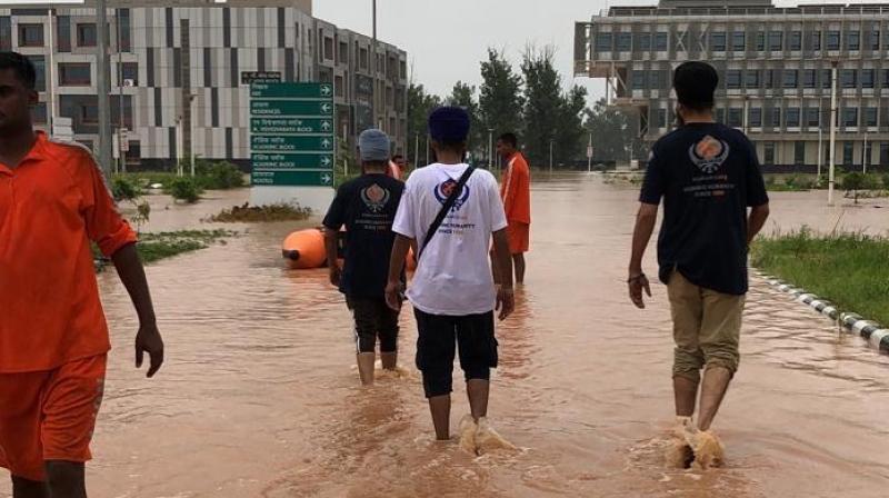 Khalsa Aid, Sikh Relief UK & other organizations came together to help flood victims