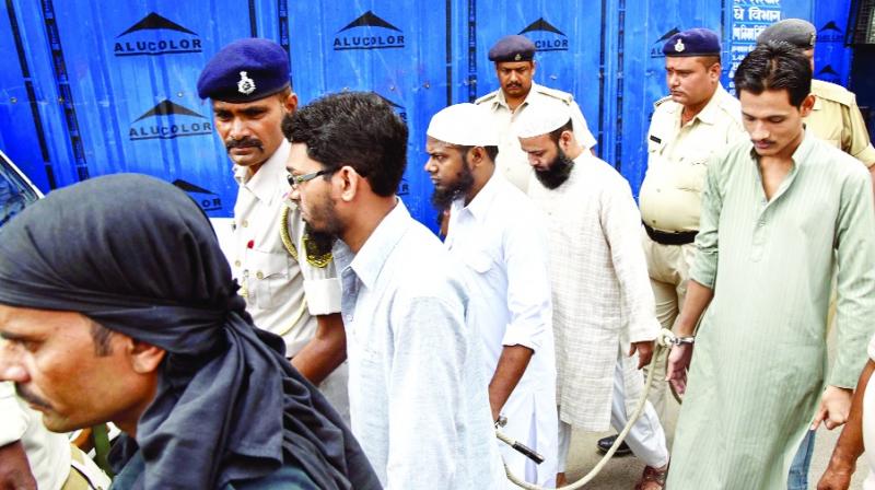 Police escorting accused Police escorting accused
