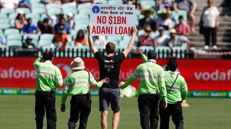 Two ‘Stop Adani’ Protesters Disrupt India-Australia ODI at Sydney Two ‘Stop Adani’ Protesters Disrupt India-Australia ODI at Sydney
