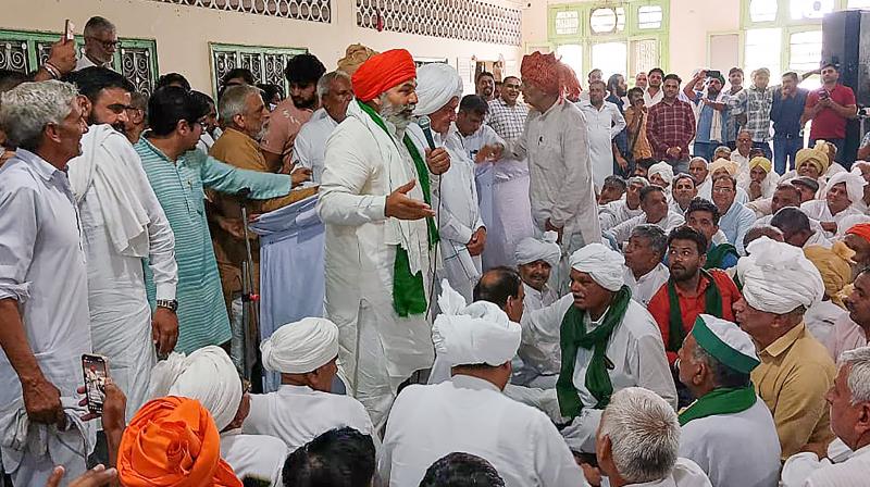 Kurukshetra: Bharatiya Kisan Union leader Rakesh Tikait with other union leaders during a 'Khap Mahapanchayat' to deliberate on the next steps to be taken in the agitation pertaining to the ongoing wrestlers' issue, in Kurukshetra, Friday, June 2, 2023.