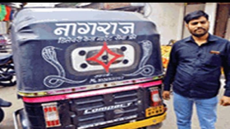 Dilip with his auto Dilip with his auto