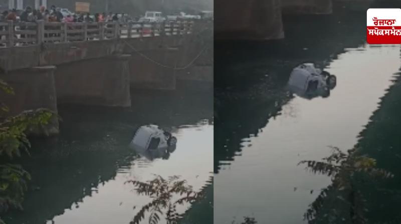 Travel vehicle hits car, car falls into canal Travel vehicle hits car, car falls into canal