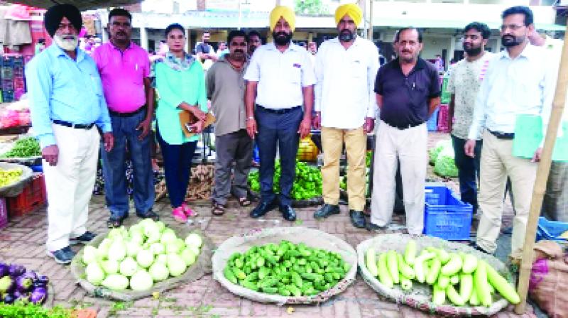 Officers during checking of fruits and vegetables Officers during checking of fruits and vegetables