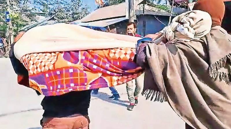 After Ram Prasad couldn't arrange a vehicle to carry the body he wrapped it up in a bedsheet to carry it on his own shoulders
