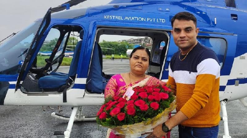 Son fulfills his mothers dream of sitting in helicopter on her 50th birthday Son fulfills his mothers dream of sitting in helicopter on her 50th birthday