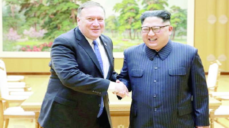 North Korean leader Kim Jong Un shakes hands with U.S. Secretary of State Mike Pompeo