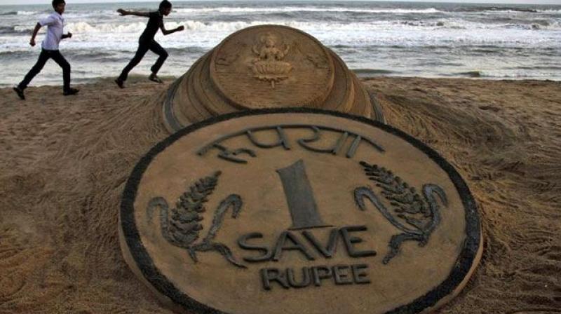 Rupee likely to test 76.50 level this year: Experts Rupee likely to test 76.50 level this year: Experts