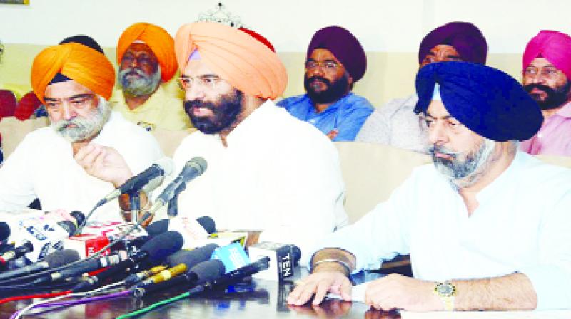 Talking to the media, Manjinder Singh Sirsa and Harmeet Singh Kalka