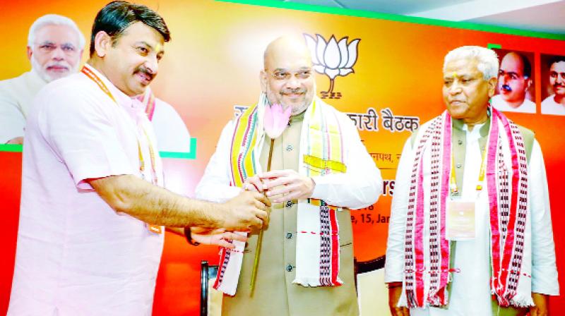 BJP President Amit Shah, Manoj Tiwari and General Secretary Ram Lal