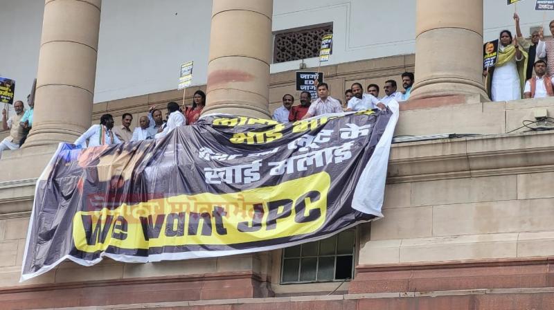 Opposition parties protest on Parliament's first floor, demand JPC probe on Adani issue Opposition parties protest on Parliament's first floor, demand JPC probe on Adani issue