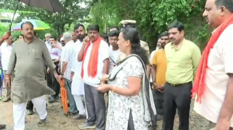 The BJP MLA rebuked the woman, took her into custody when she asked questions The BJP MLA rebuked the woman, took her into custody when she asked questions