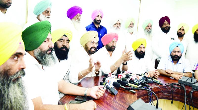 Kanwar Sandhu addressing the press conference, with Sukhpal Singh Khaira and other leaders