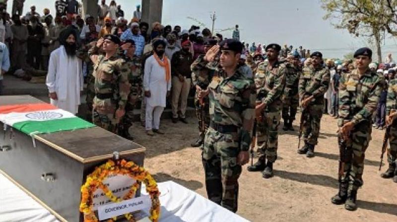 People hail Karamjeet Singh during his last rites