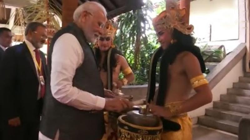 G20 summit: PM Modi tries hand at traditional Indonesian musical instrument in Bali G20 summit: PM Modi tries hand at traditional Indonesian musical instrument in Bali