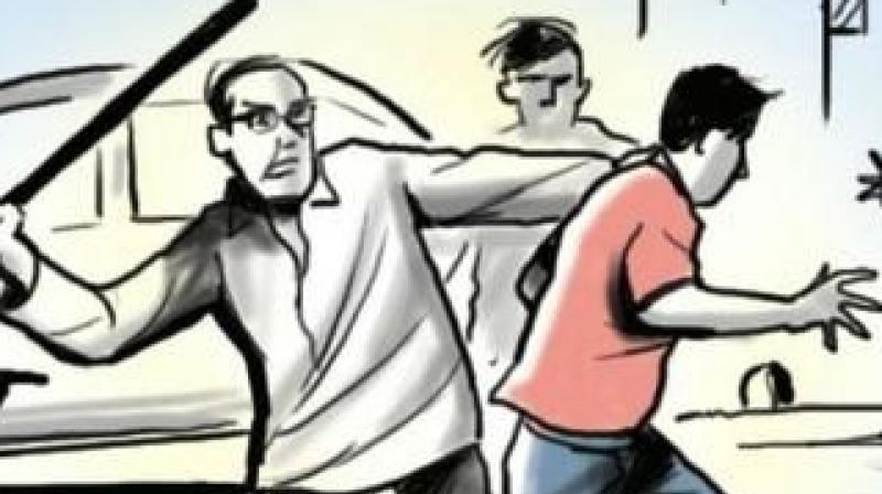 People beating Dalit People beating Dalit