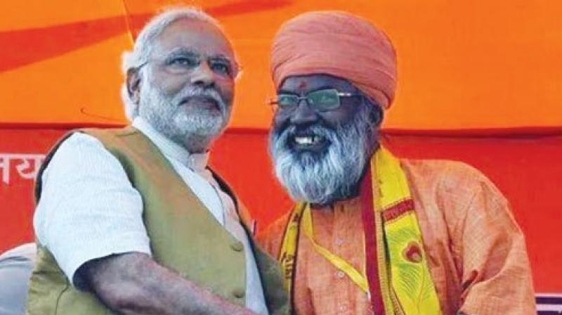 Sakshi Maharaj with P.M. Modi