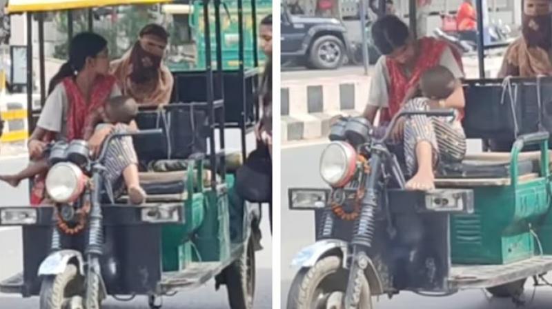 Viral video shows mother steering e-rickshaw with baby in arms; internet touched Viral video shows mother steering e-rickshaw with baby in arms; internet touched