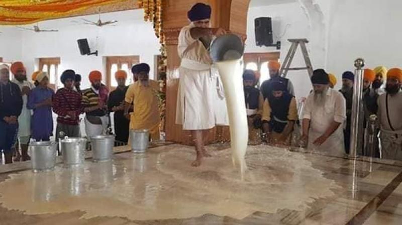 The Gurdwara washed away with milk The Gurdwara washed away with milk