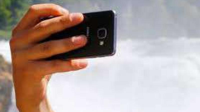 A person fall down 30 feet while taking selfies from a hill A person fall down 30 feet while taking selfies from a hill