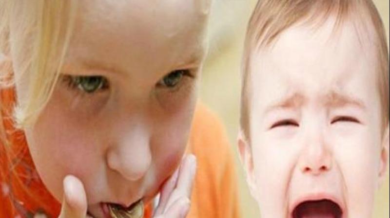 coin in child 's mouth coin in child 's mouth
