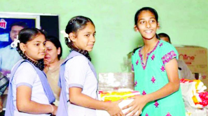 Indian girl distributed sanitary pad to aboriginal girls in Dubai