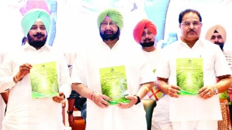Issuing Booklets by Captain Amarinder Singh and others.